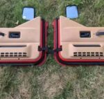 OEM interior half door panels with uppers for a 1997-2006 Jeep Wrangler TJ half-door model.