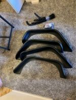 A set of black fender flares for a Jeep Wrangler models